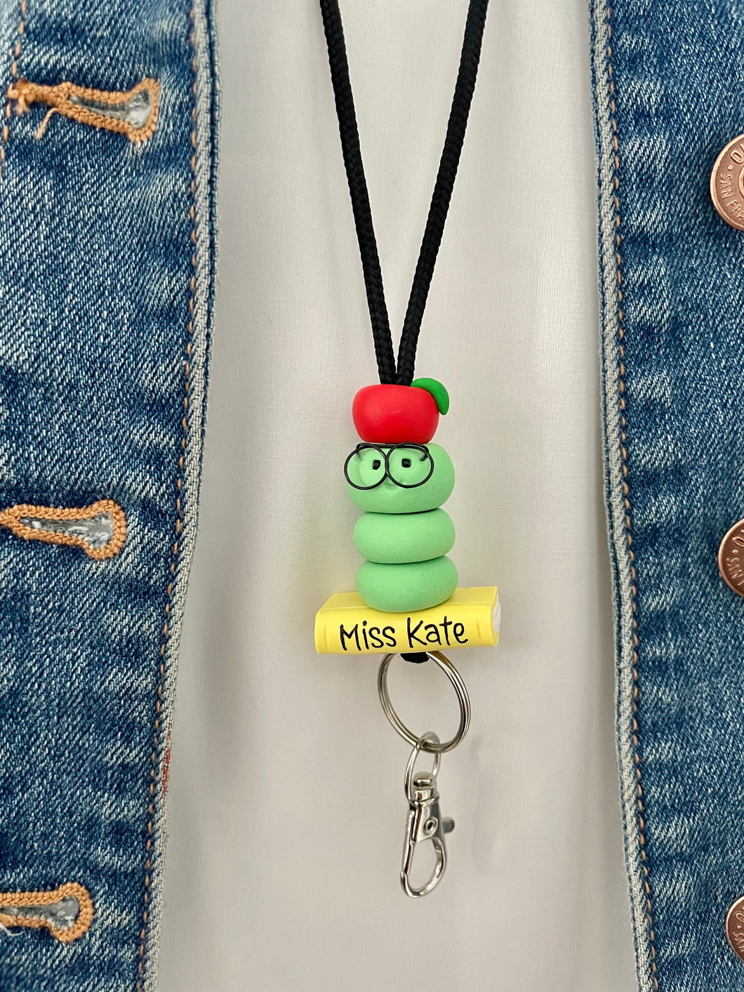Teacher lanyard with bookworm, book and apple