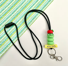 Load image into Gallery viewer, Teacher lanyard with bookworm, book and apple
